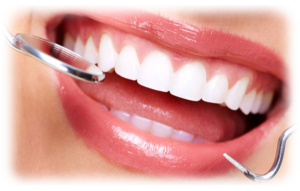 A young woman smiling while getting a deep dental cleaning.