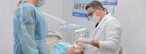 A patient being examined by a dentist, relaxed from laughing gas.